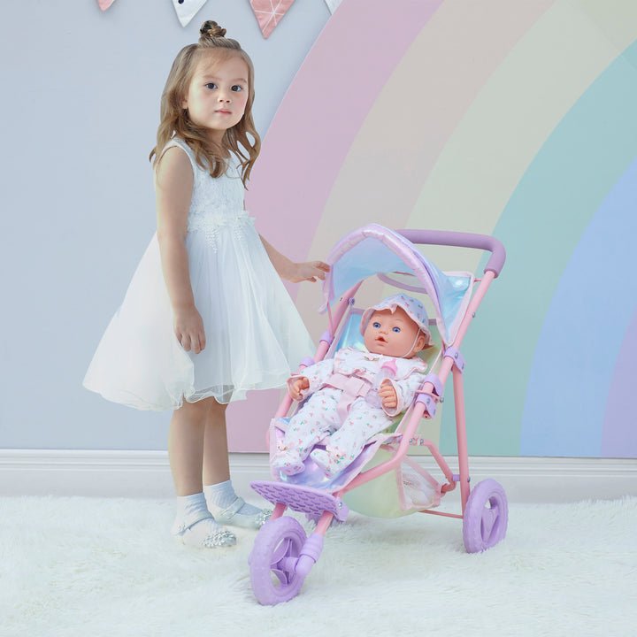 A little girl is standing next to an iridescent baby doll jogging stroller.