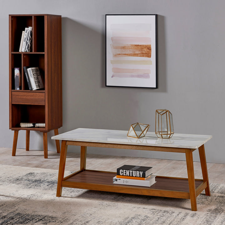 A Teamson Home Kingston Wooden Coffee Table with Storage and Marble-Look Top, Marble/Walnut with a durable structure and bookshelf.