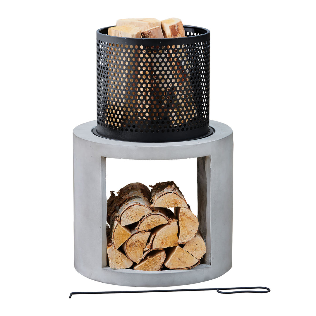 A Teamson Home Outdoor 16" Wood Burning Fire Pit with Decorative Log Storage Base, Gray/Black, with logs stocked underneath in the base and logs inside the burning space