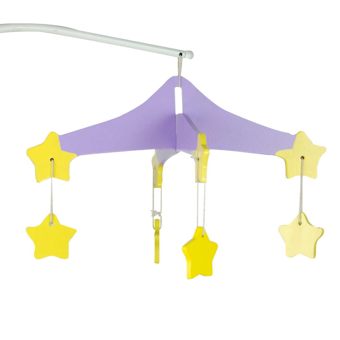 A close-up of a mobile on the baby doll changing station with a purple hanger and yellow stars dangling.