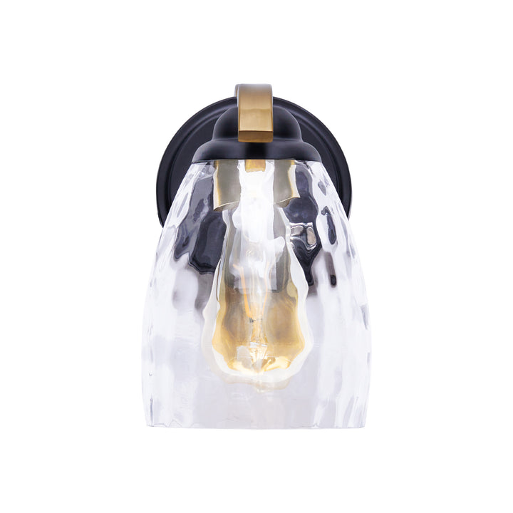 A view from the front of a Teamson Home Heidi Wall Sconce with Clear Hammered Glass Cloche Shade, Black/Brass