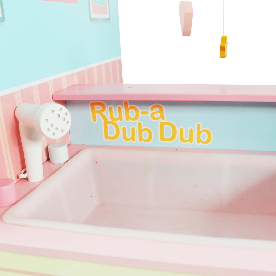A close-up of the sink bathtub with the faucet and the  caption "Rub-a Dub Dub."