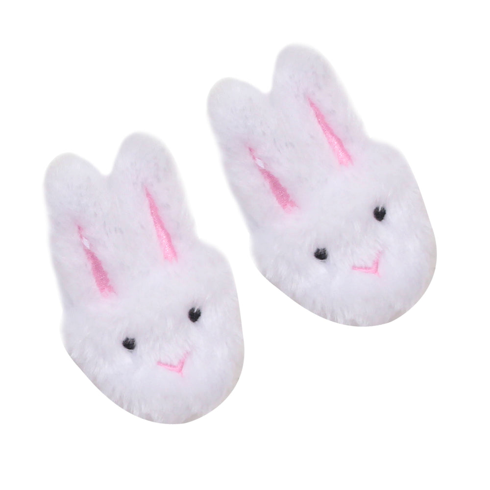 A pair of Sophia’s White Bunny Slippers with Rabbit Ears for 18" Dolls, with white bunny ears on a white surface.