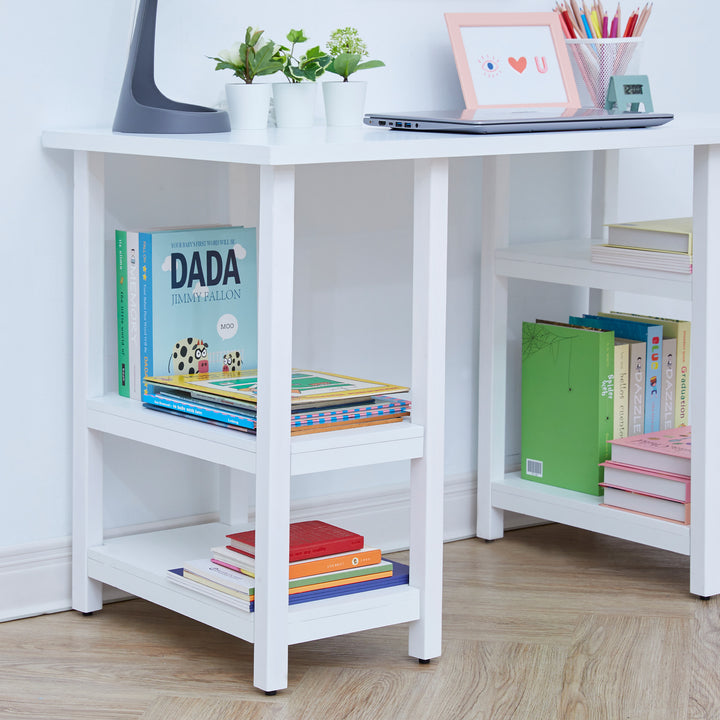 Close up shelving on a white children's desk with books.