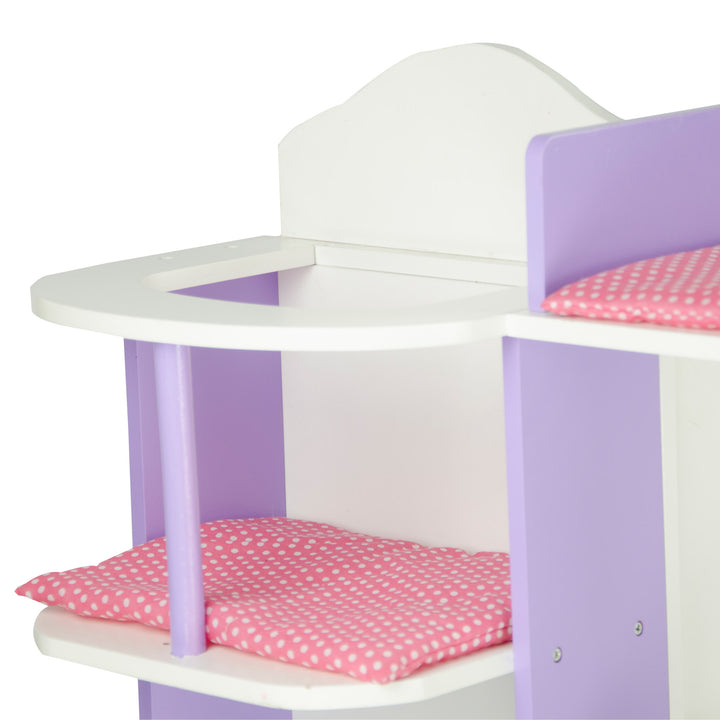 A close-up of the baby doll changing station's high chair in white with purple accents and a pink cushioned seat.