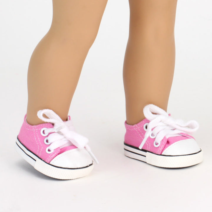 A pair of Sophia’s light pink canvas sneaker shoes for 18" dolls on a white background.