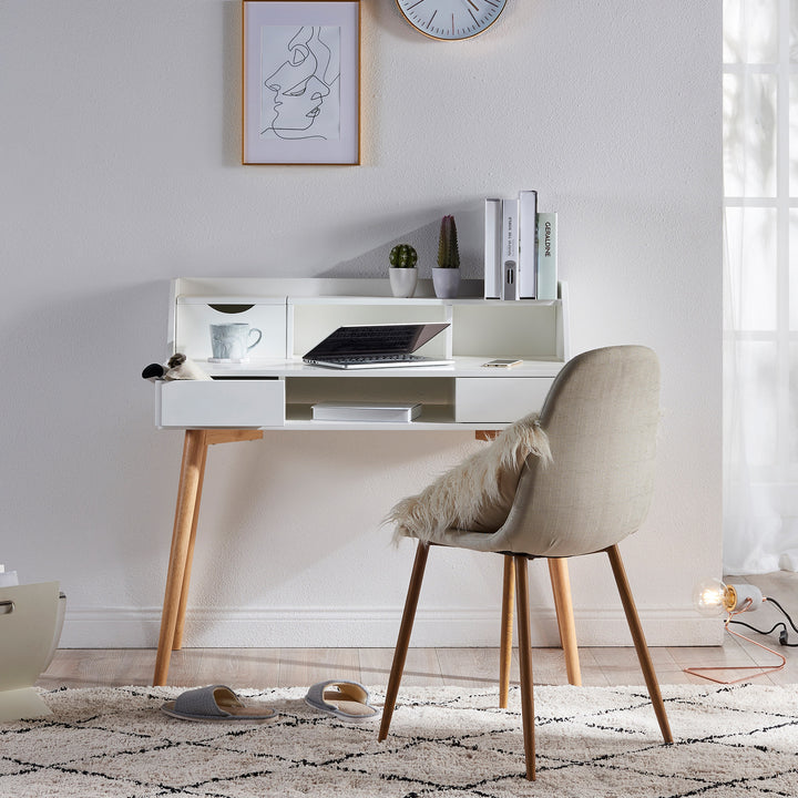 A durable Teamson Home Creativo Wooden Writing Desk with Storage in a room with a chair and a clock.