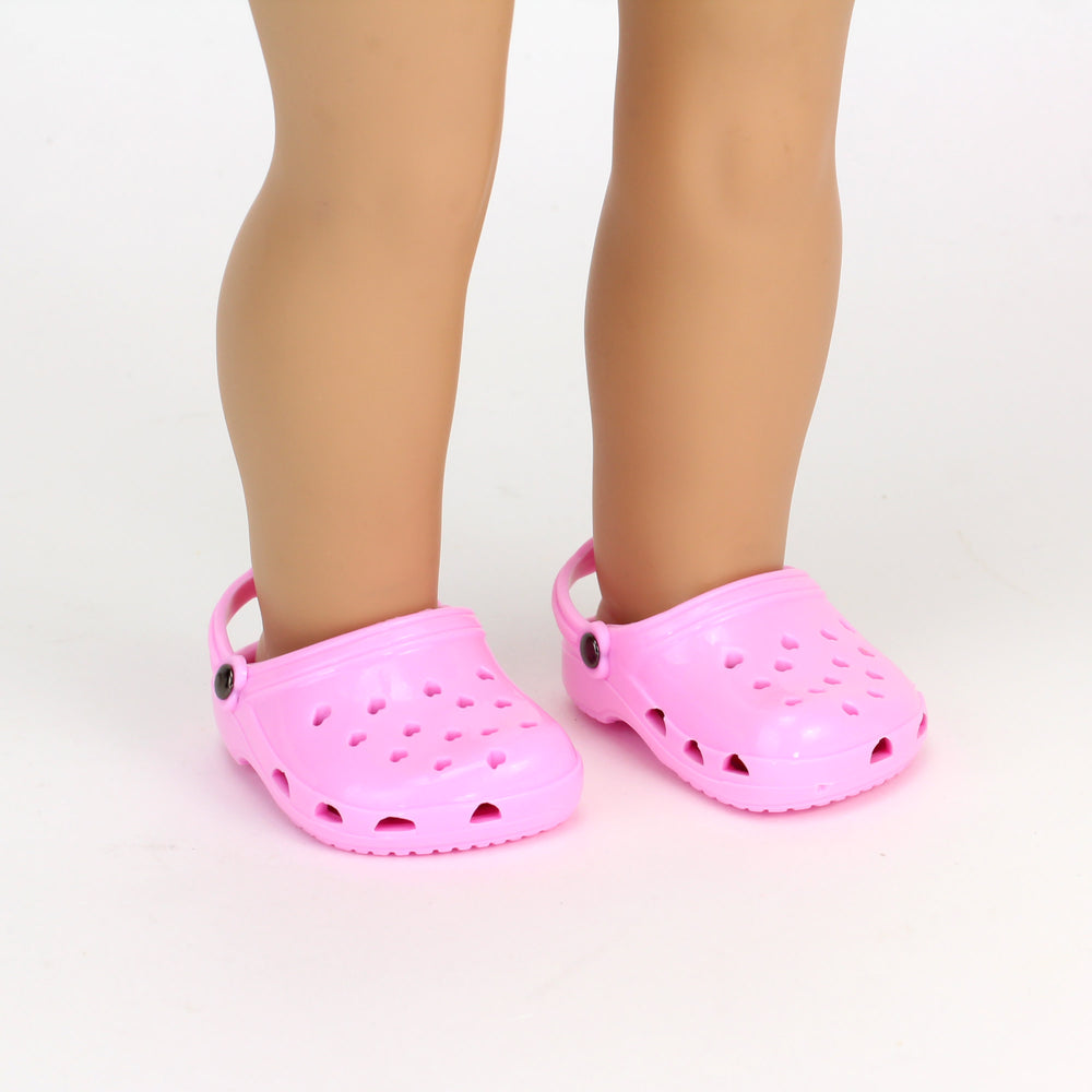 A pair of pink garden clogs for an 18" doll.