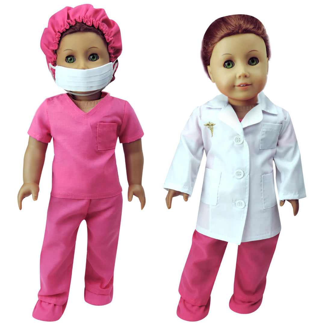 A doll dressed in pink surgical scrubs, cap, and shoe covers, and a doll dressed in pink scrubs and a white lab coat.