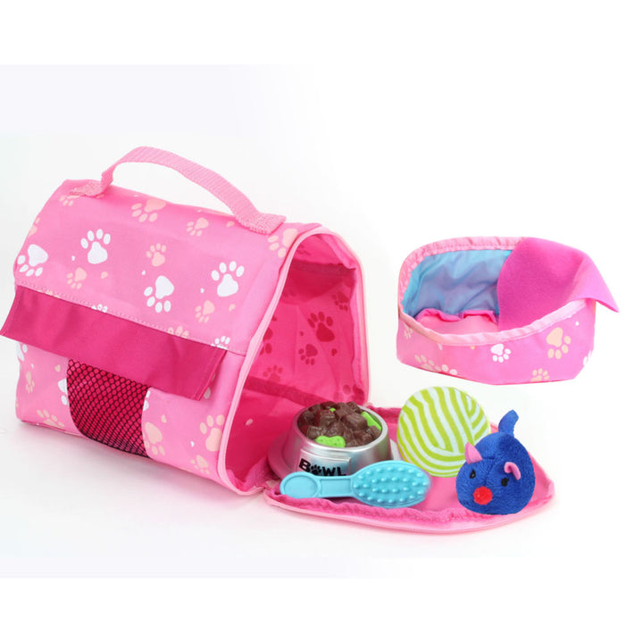 A view of the accessories that comes with the white kitten: a carrier, faux pet food, a brush, a green ball, a blue toy mouse, a pet bed and a blanket.