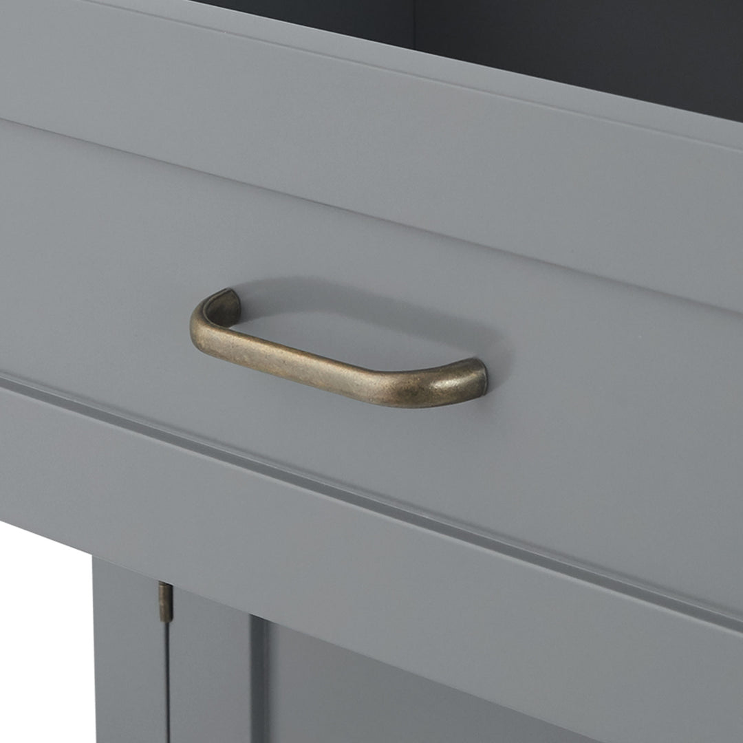 The top drawer open and a close-up of the brass pull handle
