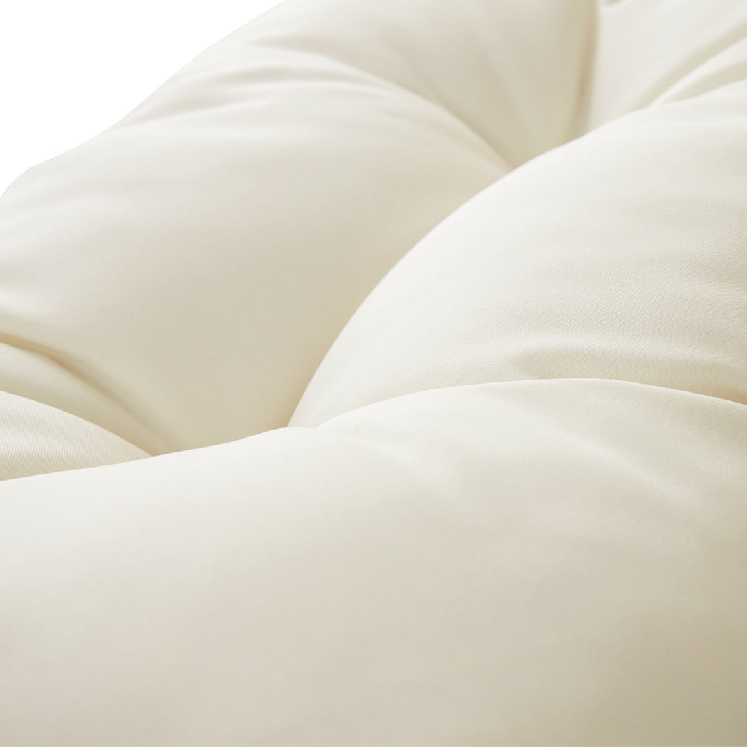 Close-up of the white weather-resistant cushions.