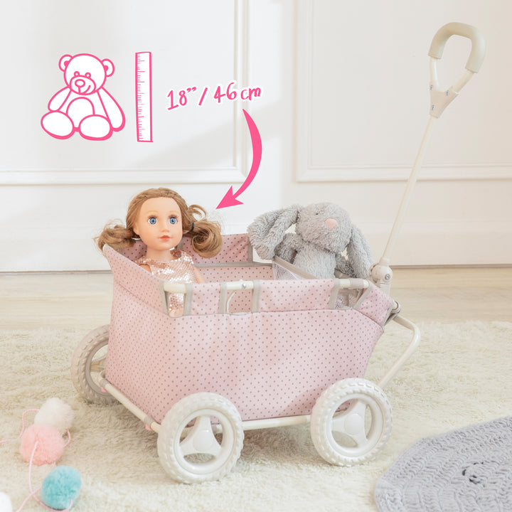 A pink with gray polka dots baby doll wagon with a doll and a stuffed bunny inside and a graphic of a bear and ruler and the caption 18" / 46 cm