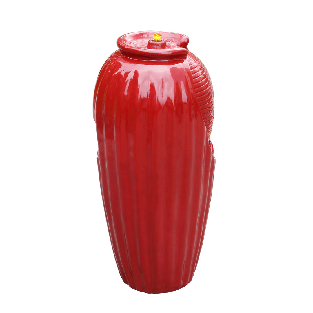 A Teamson Home Indoor/Outdoor Contemporary Glazed Contoured Vase Water Fountain with LED Lights, Red with vertical ribbing and LED lights on a white background.