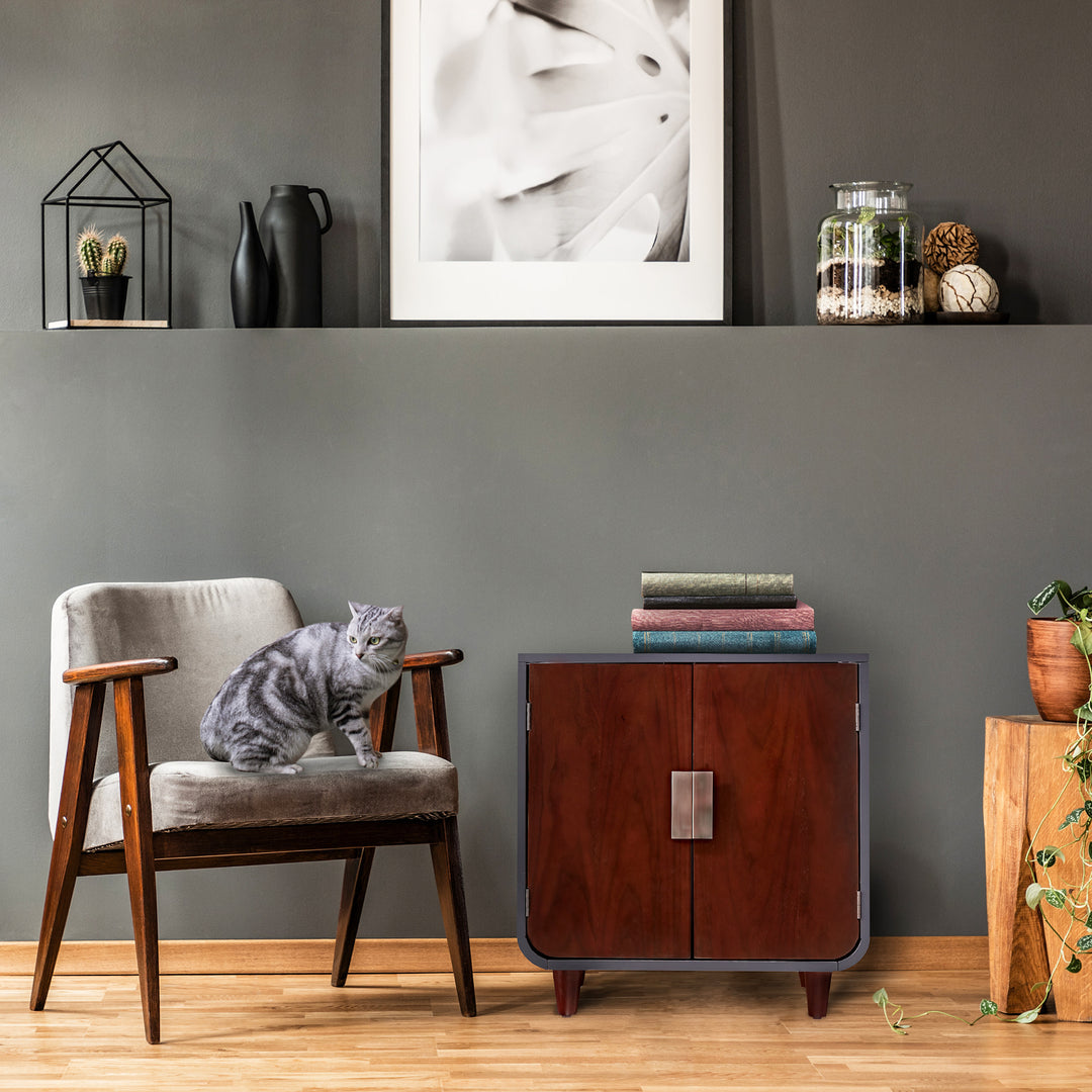 Teamson Pets Small Dyad Wooden Cat Litter Box Enclosure and Side Table, Mocha Walnut, against a dark green wall.