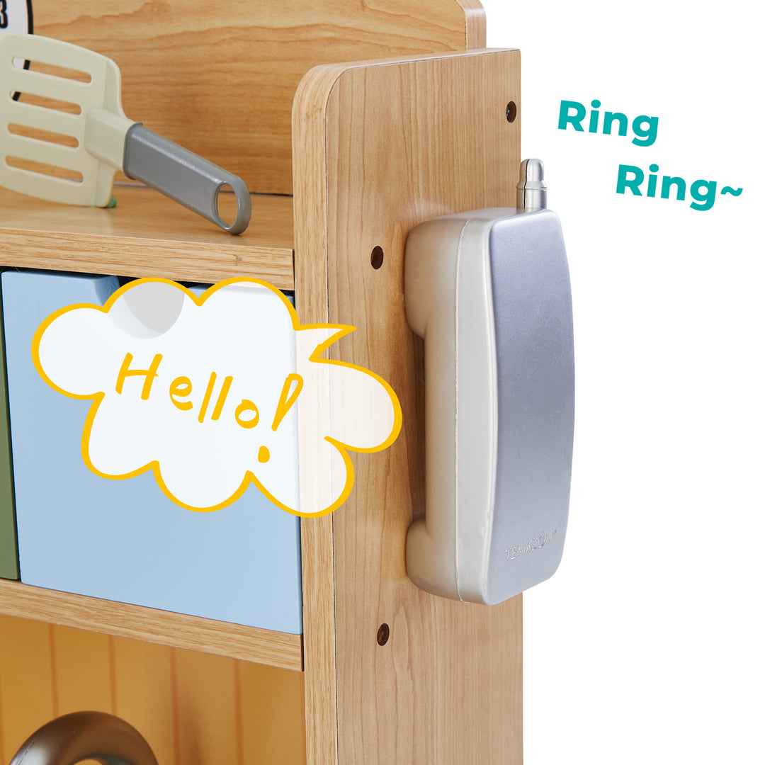 Close up of the play telephone on the side of the kitchen. Doodles on the image that says Ring Ring and Hello!