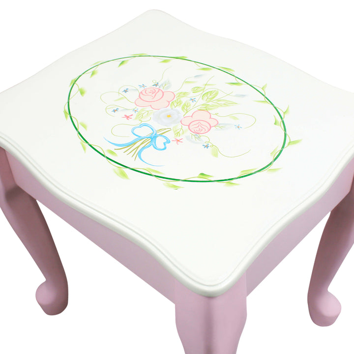 A pink Fantasy Fields Kids Furniture Play Vanity Table and Stool with a floral design on it.