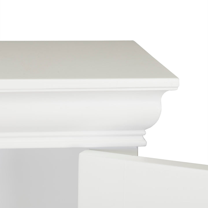 Close-up of a Teamson Home Stratford Wooden Space Saver with Shutter Doors, White cornice molding detail against a white background.