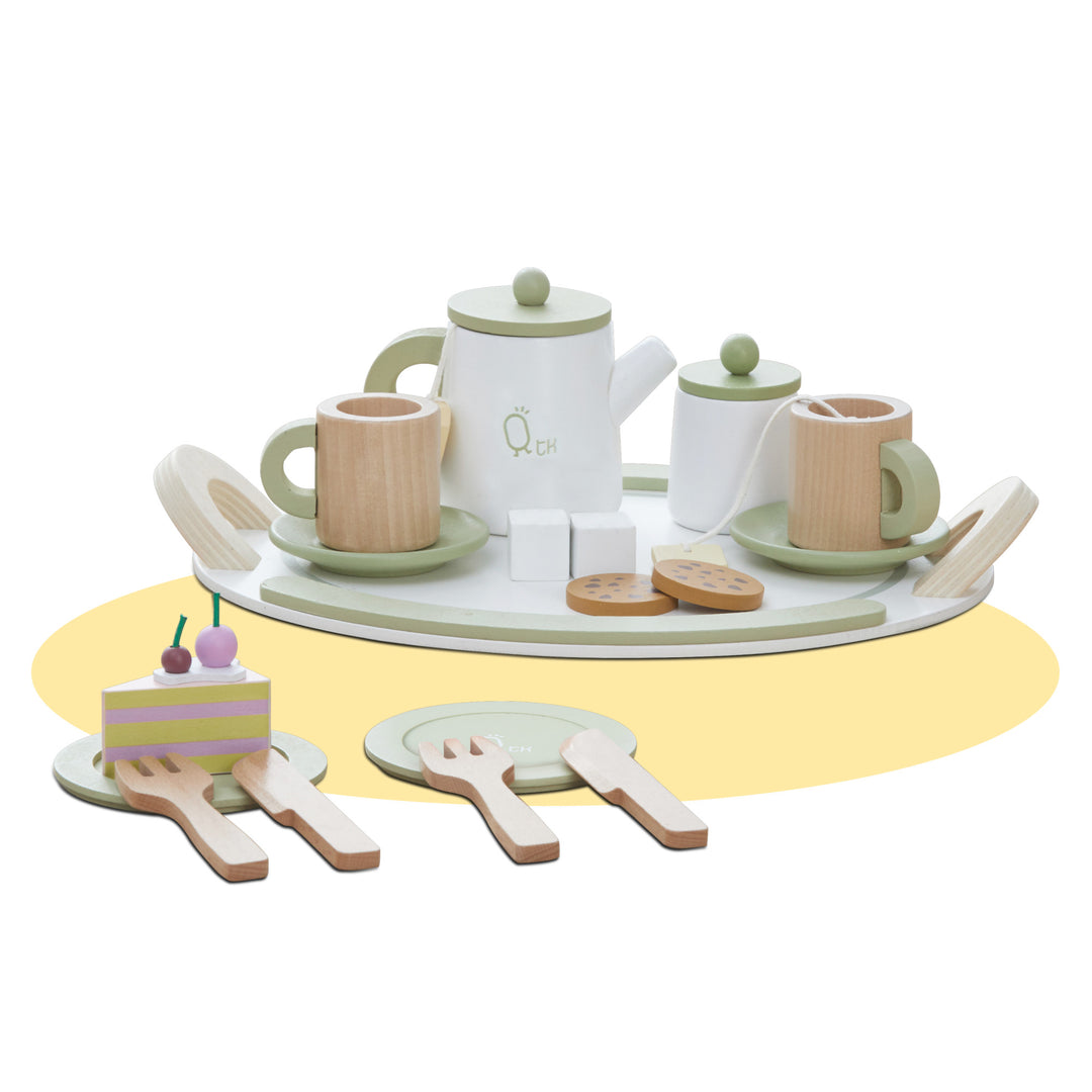 Teamson Kids Little Chef Frankfurt 20 Piece Wooden Play Kitchen Tea Party Set, Green displayed on a round tray, perfect for kids' tea parties, including cups, a teapot, spoons, biscuits, and a slice of cake.