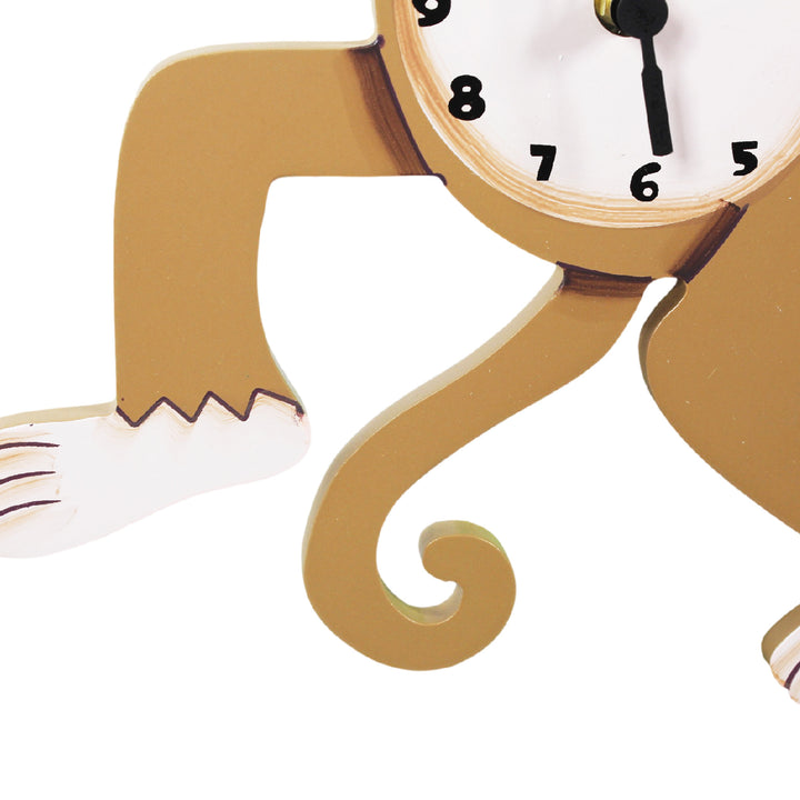 Close-up of the monkey's tail, foot, and the bottom of the clock.