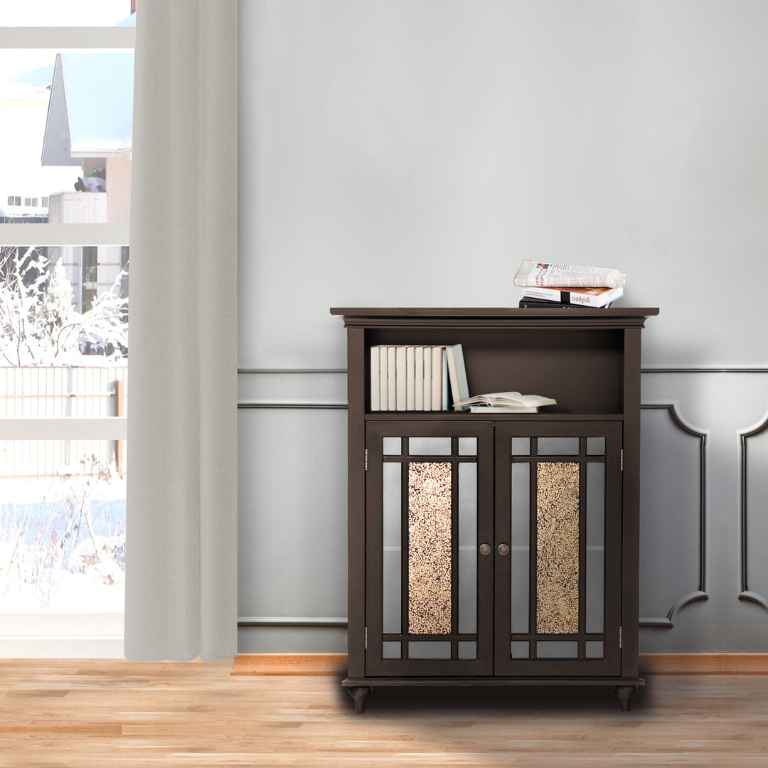A dark expresso Teamson Home Windsor Floor Cabinet with Glass Mosaic Doors in gray room next to a window with books on the open shelf