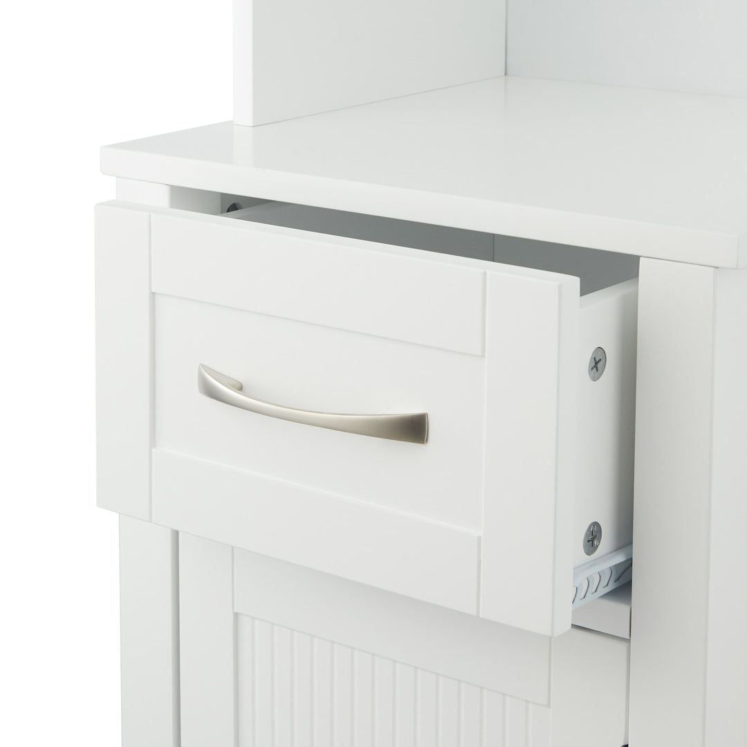 A close-up of the open drawer in the White Teamson Home Newport Contemporary Tower Storage Cabinet