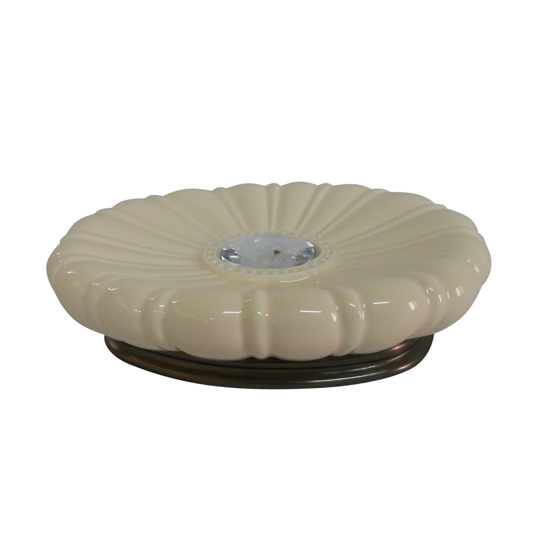 An elegant, ivory soap dish in the shape of a flower on a black base.