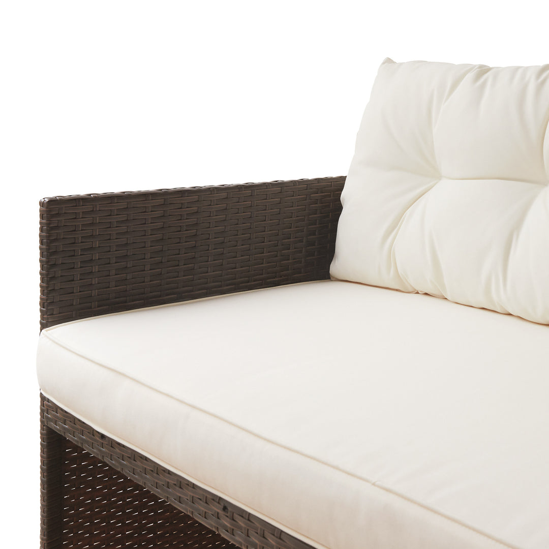 Close-up of the brown PE rattan and white cushions