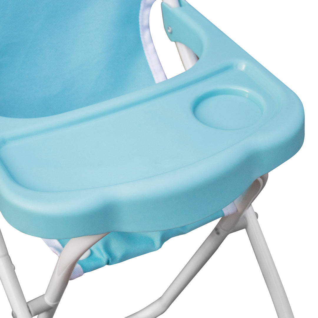 A close-up of the tray on a blue and white baby doll high chair.