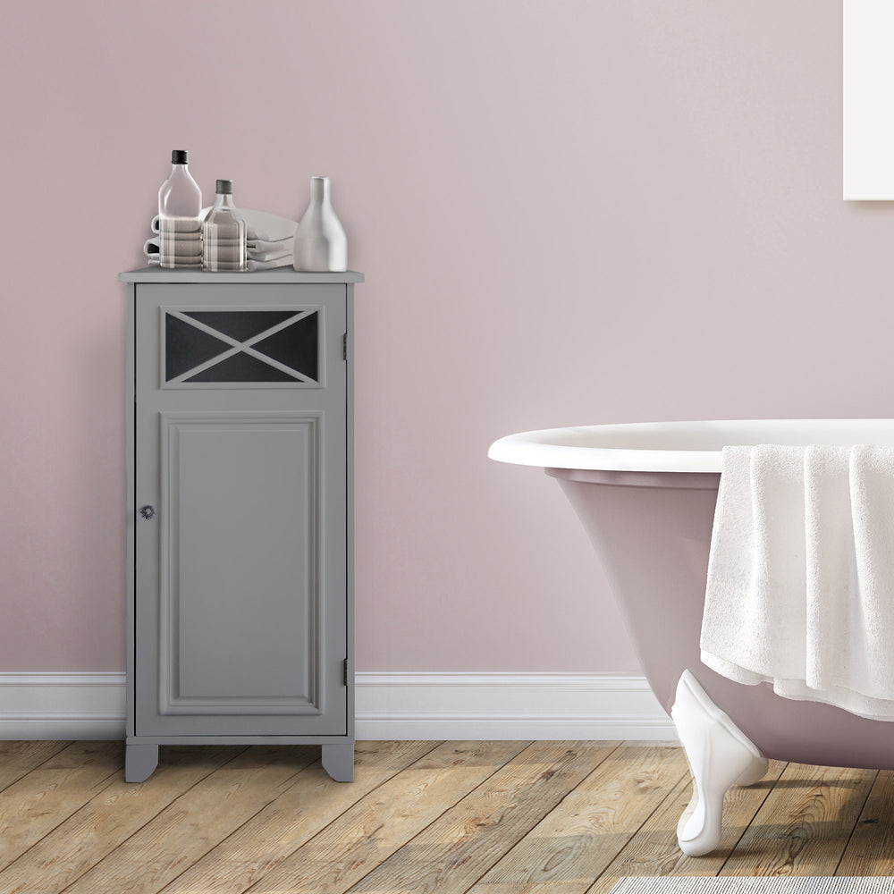 A gray Dawson Floor Storage Cabinet with Door against a mauve colored wall next to a bathtub