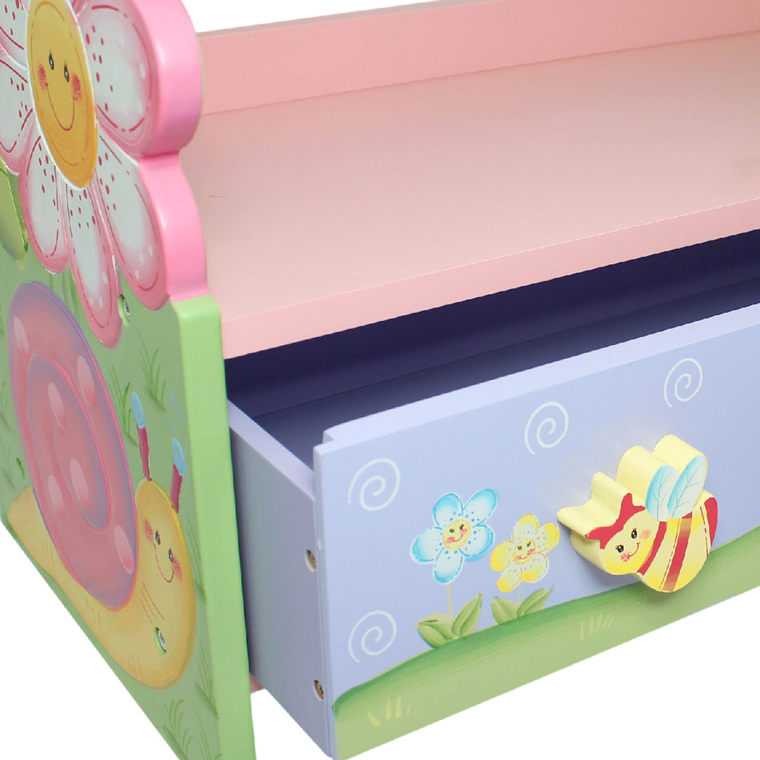 A Fantasy Fields Magic Garden Wooden Bookshelf with Storage Drawers, Multicolor with a flower and butterflies on it.