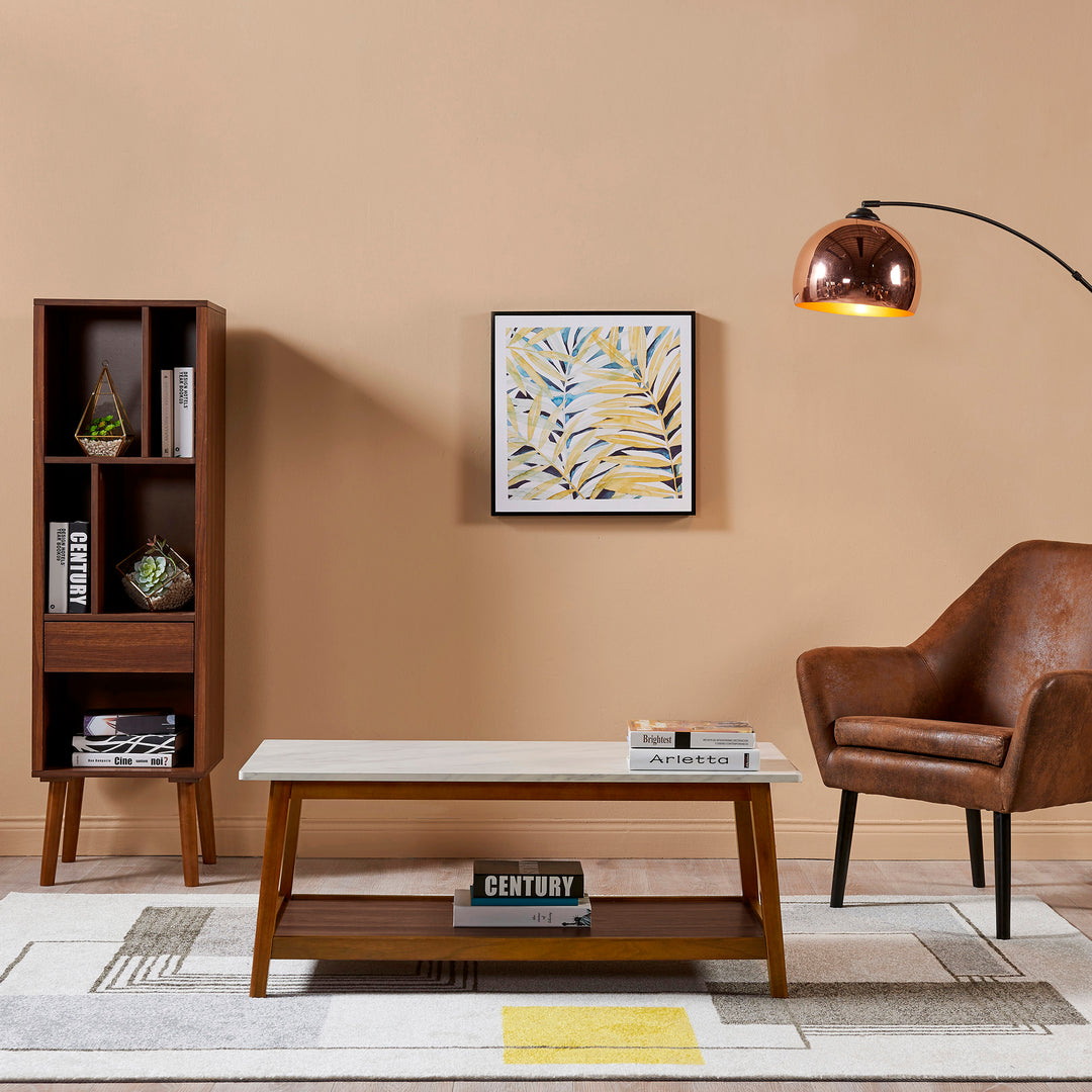 A living room with a Teamson Home Kingston Wooden Coffee Table with Storage and Marble-Look Top and a lamp.