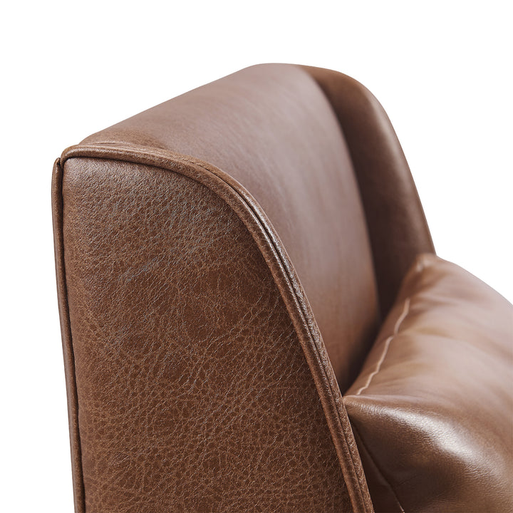 A close up of a Teamson Home Marc Faux Leather Lounge Chair with Pillow and Solid Wood Legs, Brown.
