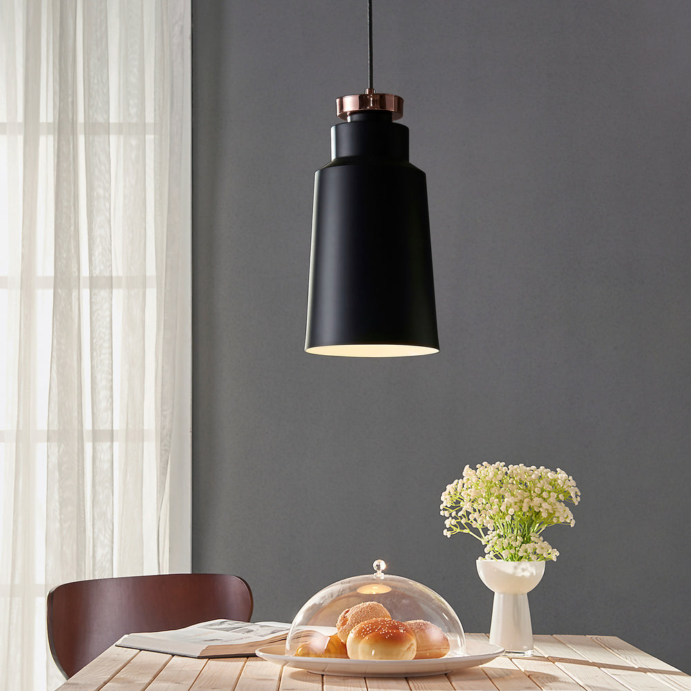 Teamson Home Stile Metal Mini Pendant Light, Black with Copper accents hung over a small table with flowers and baked goods