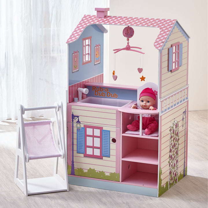 A nursery Olivia's Little World Baby Doll Changing Station Dollhouse with Storage, Multicolor with a baby in it.
