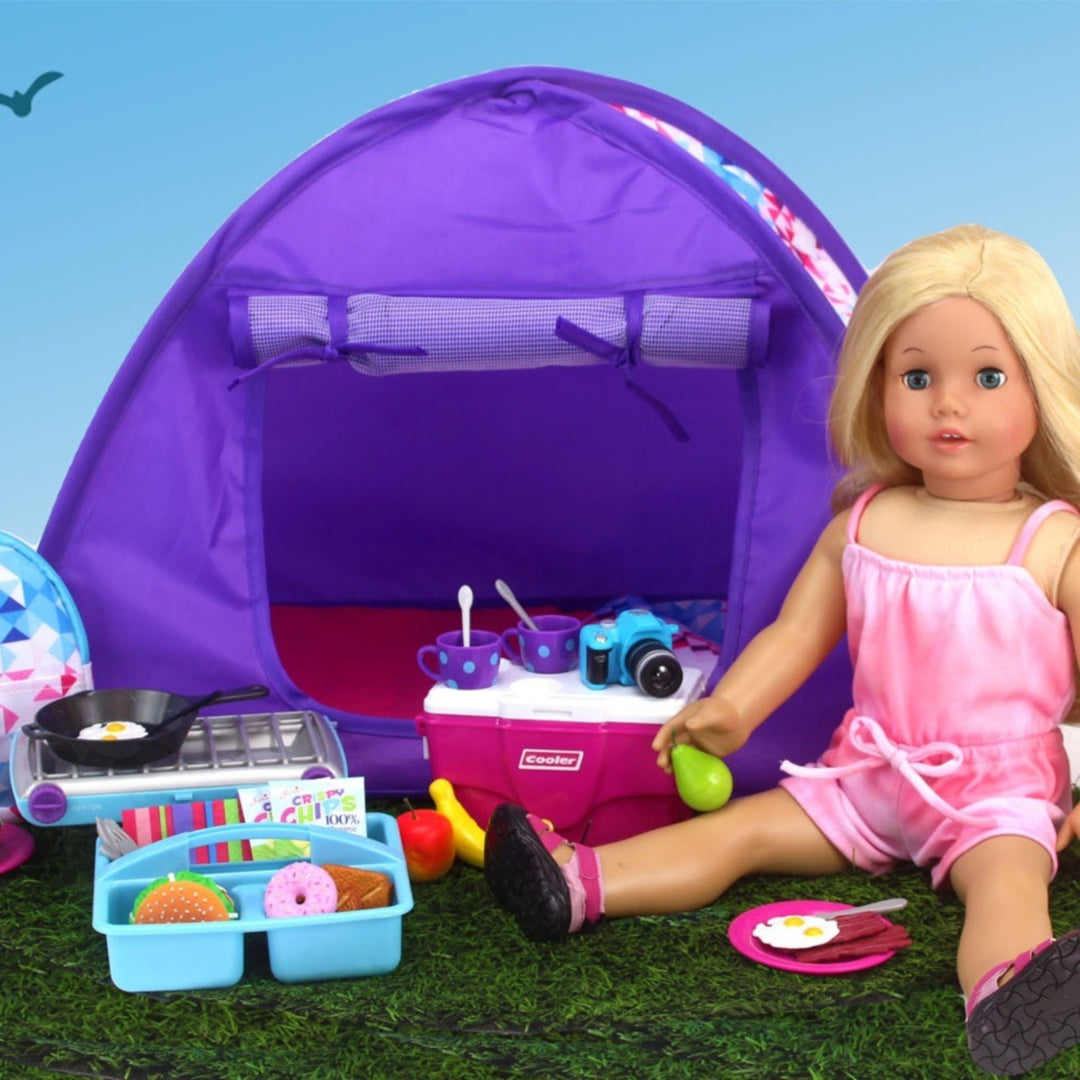 A high-quality Sophia's 9 Piece Camp Stove and Food Set for 18" Dolls sitting on grass with a tent and food.