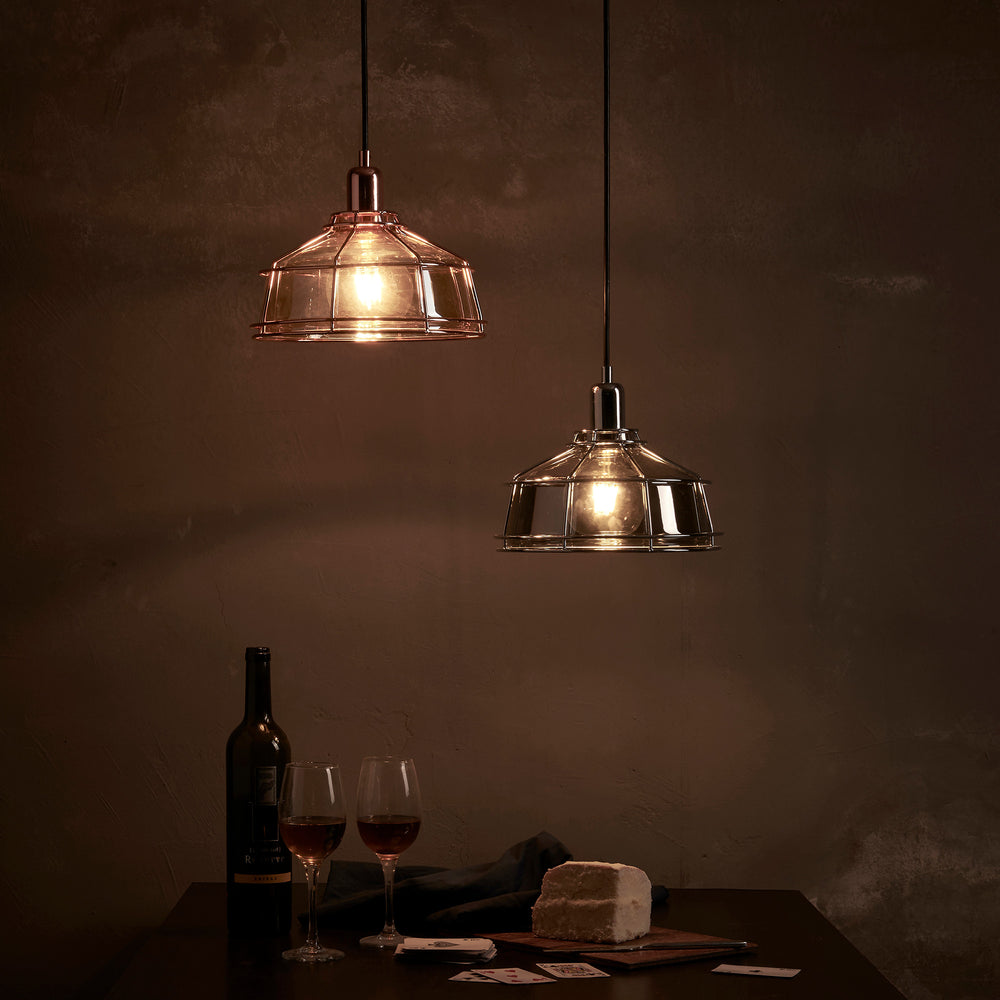 Teamson Home Presenza Chrome Pendant Lamp with Industrial Cage hung over a table with cards and beverages