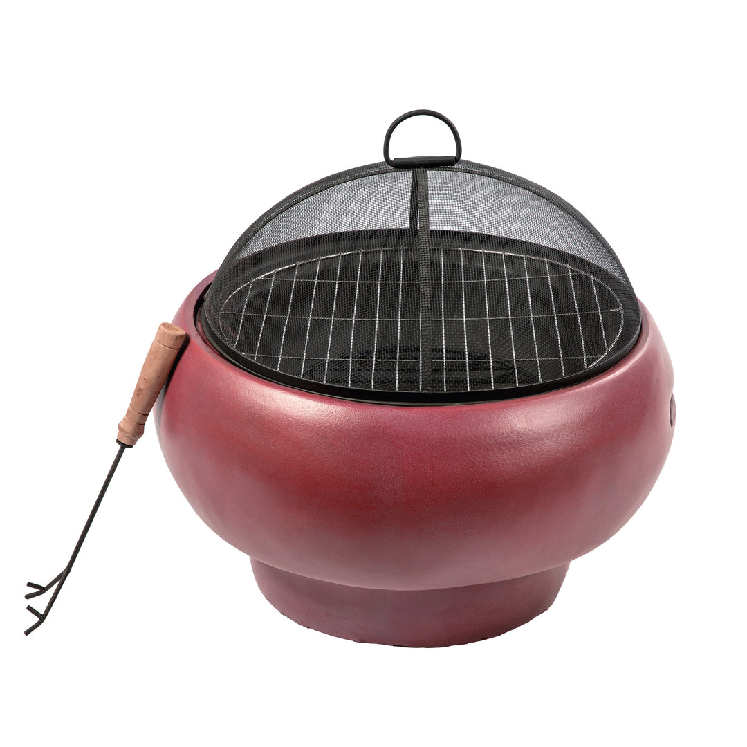 A red faux concrete fire pit with a black mesh spark screen and poker leaning against it