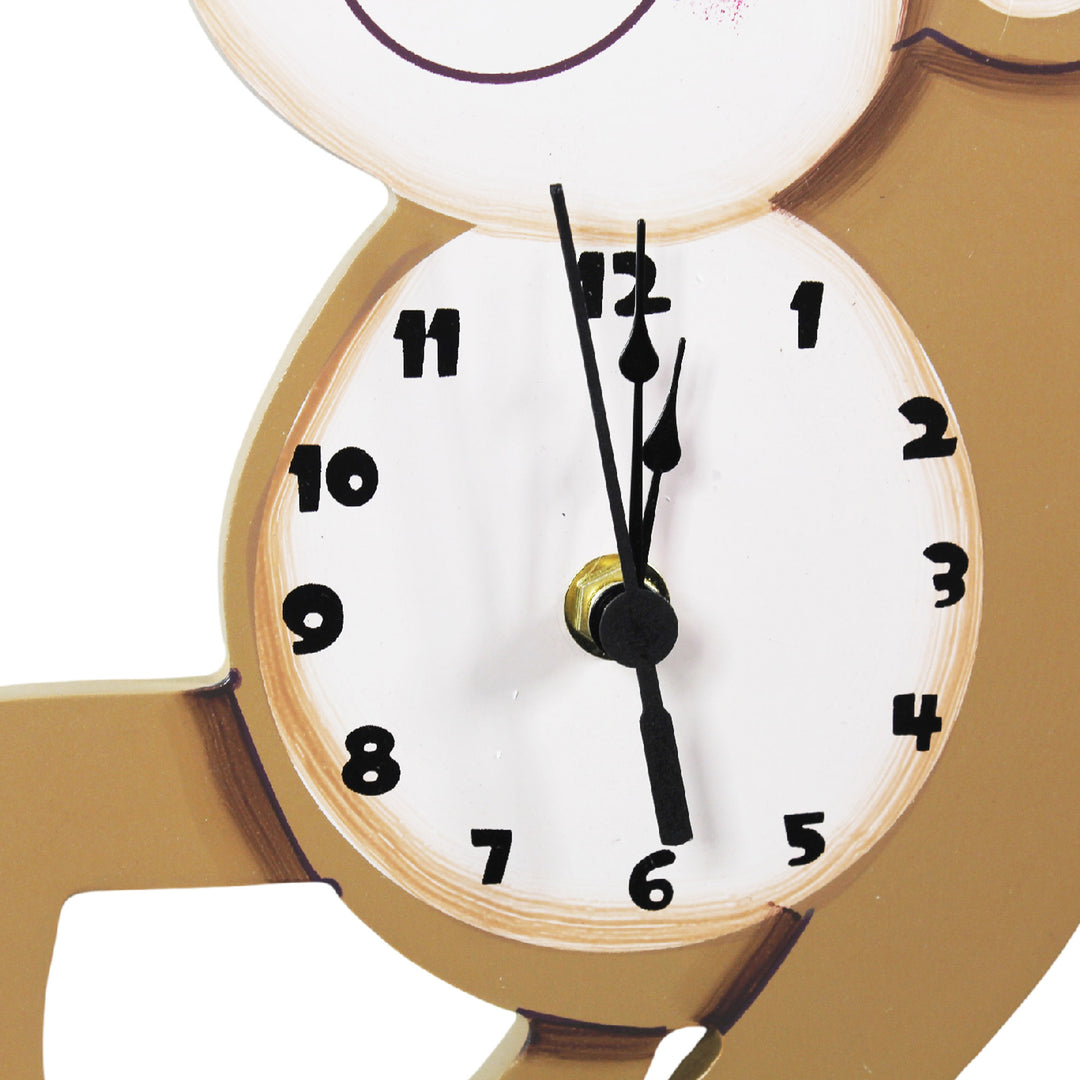 Close-up of the clock face on the monkey's stomach.