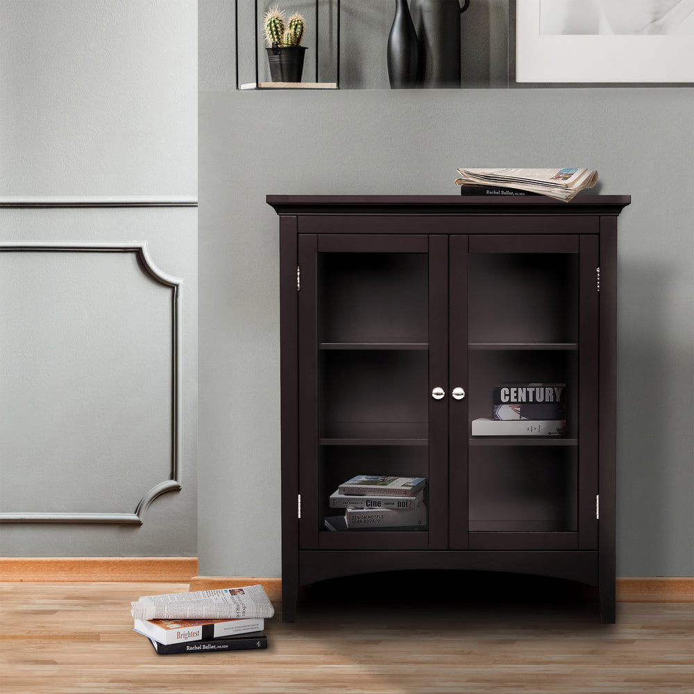 A Teamson Home Madison Floor Cabinet with Double Doors, Espresso, against a sage green wall with books inside