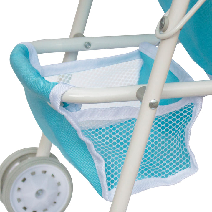 A close-up of a storage basket on the bottom of a blue and white baby doll stroller.