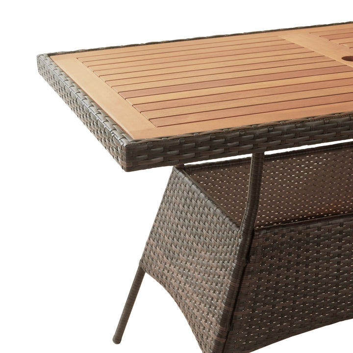 Close-up of the Acadia wood table top and PE rattan framework
