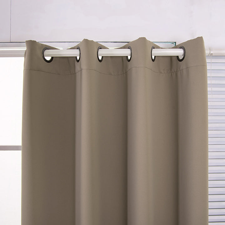 Sepia Brown polyester curtains hung on a rod in a windowed room with white blinds