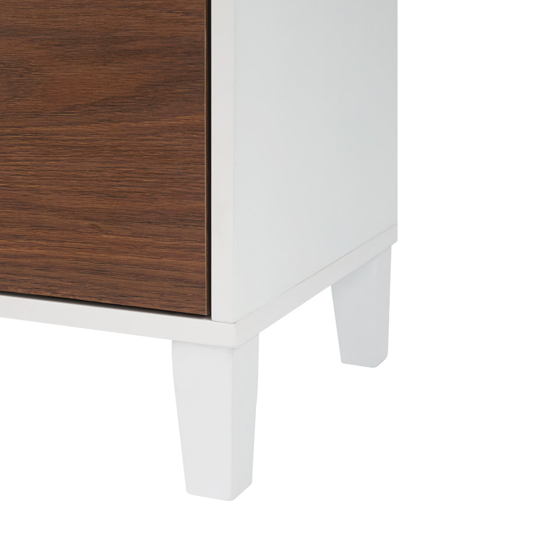 A close-up of the tapered block legs on the bottom of the cabinet