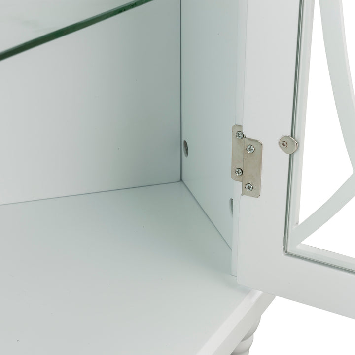 Close-up of the chrome hinges and the bottom of the cabinet
