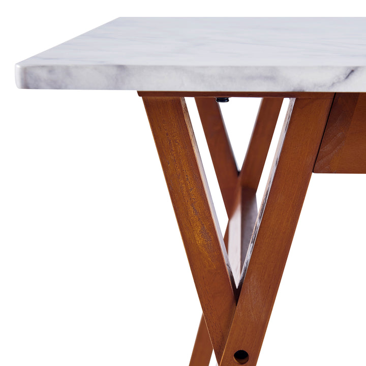 Close-up of where the faux marble table top fits upon the table