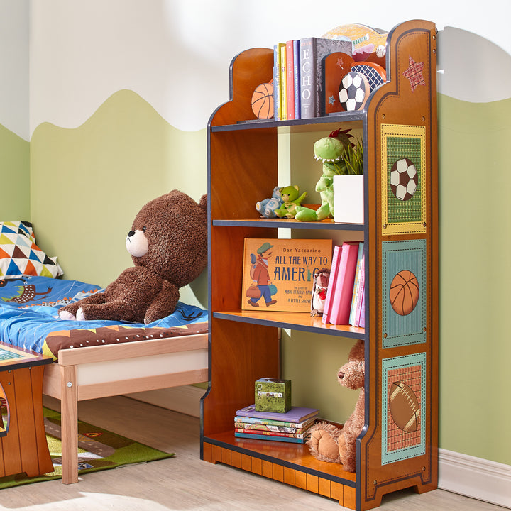 A child's room with a Fantasy Fields Little Sports Fan Kids Furniture Tall Bookshelf, Brown and a teddy bear.