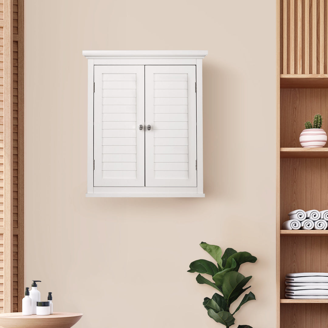Teamson Home White Glancy Wall Cabinet with Louvered Doors by wooden shelves and bathroom accessories.