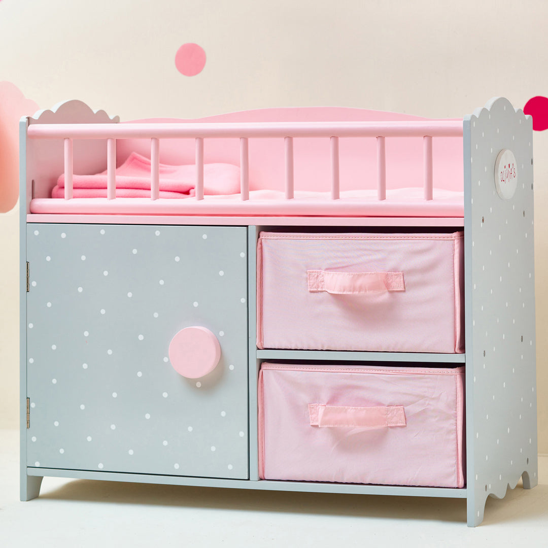 A Olivia's Little World Polka Dots Princess Baby Doll Crib with Storage Closet and Drawers, Gray/Pink with easy-to-clean surfaces.