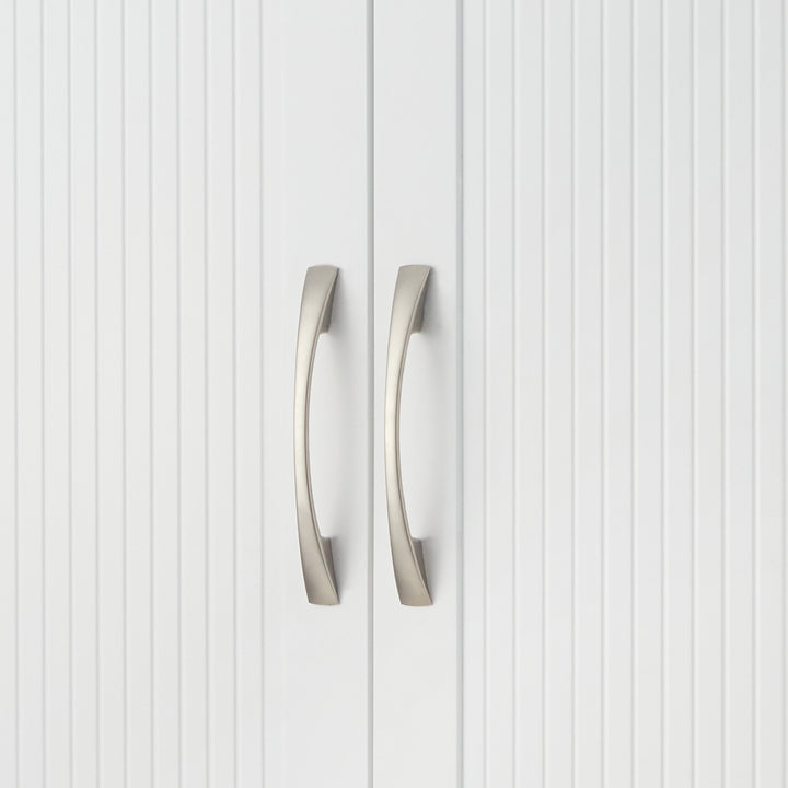 Close-up of the satin nickel pull handles on the cabinet doors
